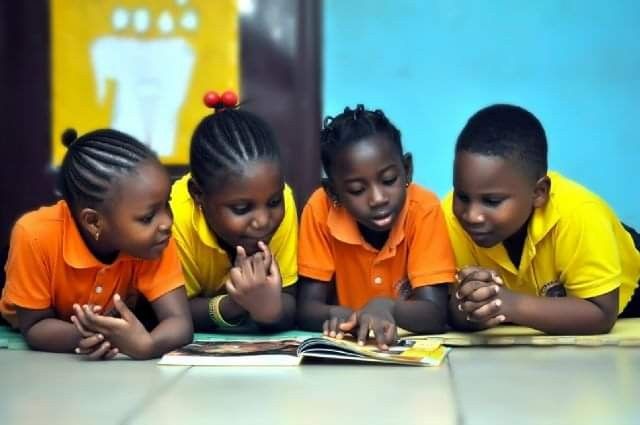 Children reading together at a Peace Club