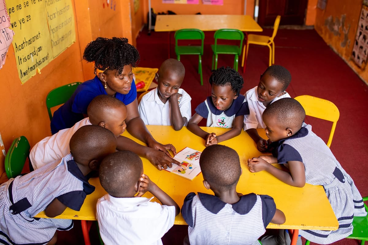 Children in a classroom with peace curriculum materials